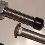 Carriage bolt with nut and plastic end cap assembled