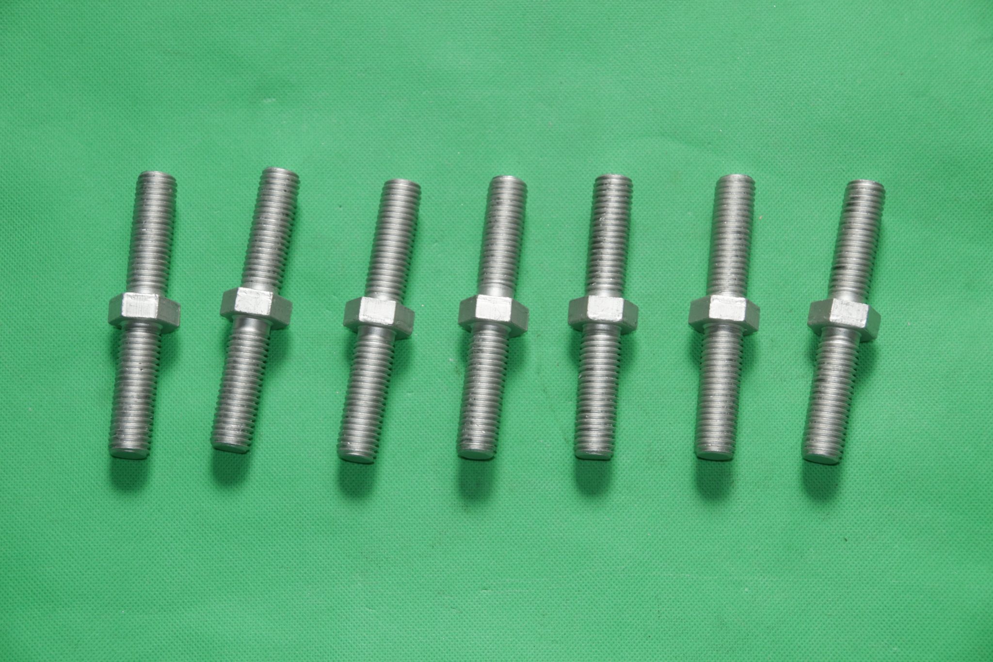 Double end threaded bolt with hex shank